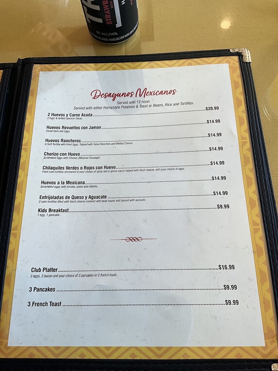 Menu page beside a table setting.
